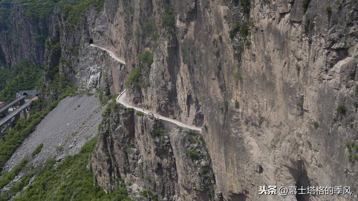 html这条挂壁公路在太行绝壁之上连凿5个山洞,最上面的洞和最下面的洞