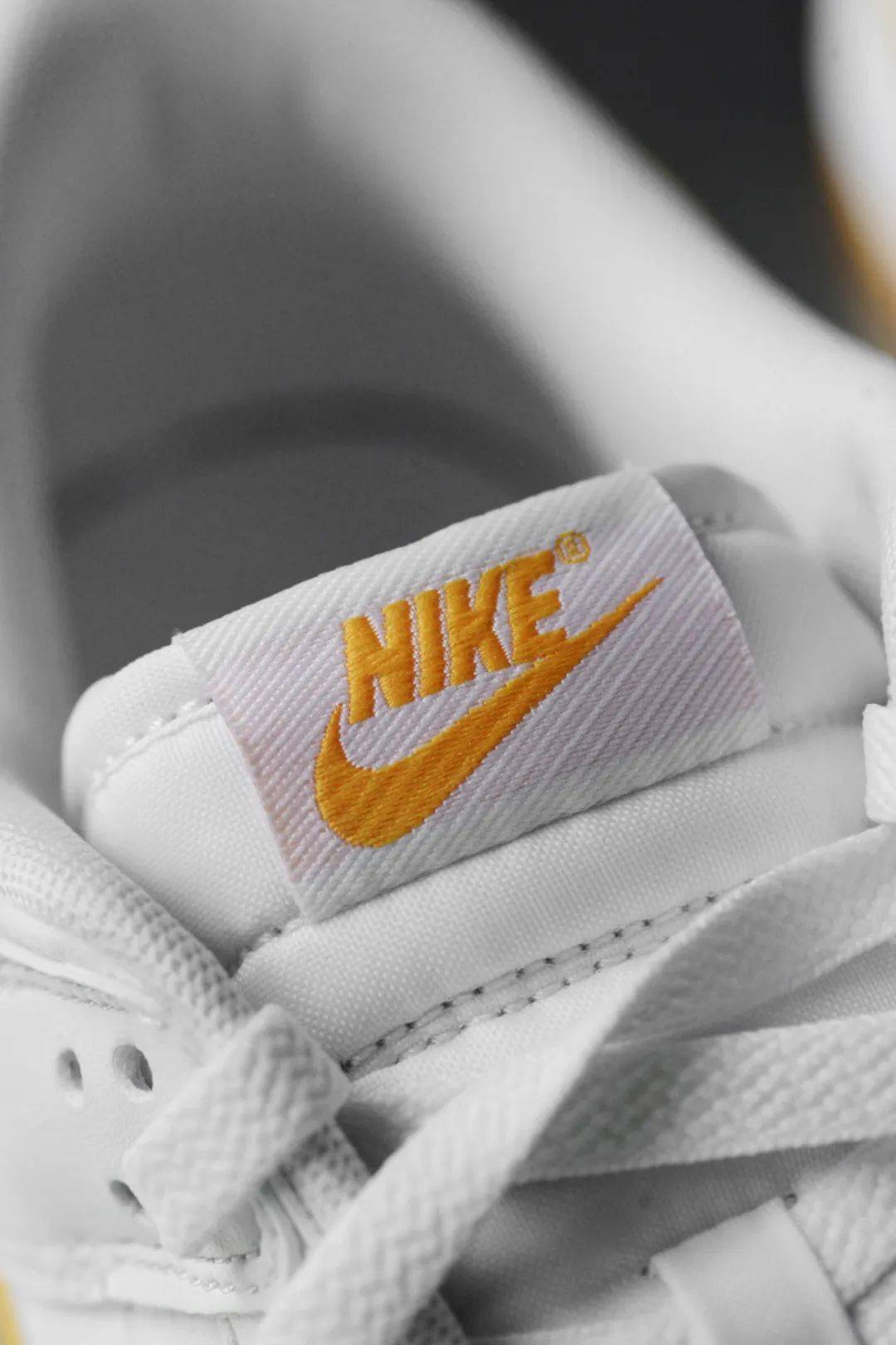 nike dunk low retro university gold