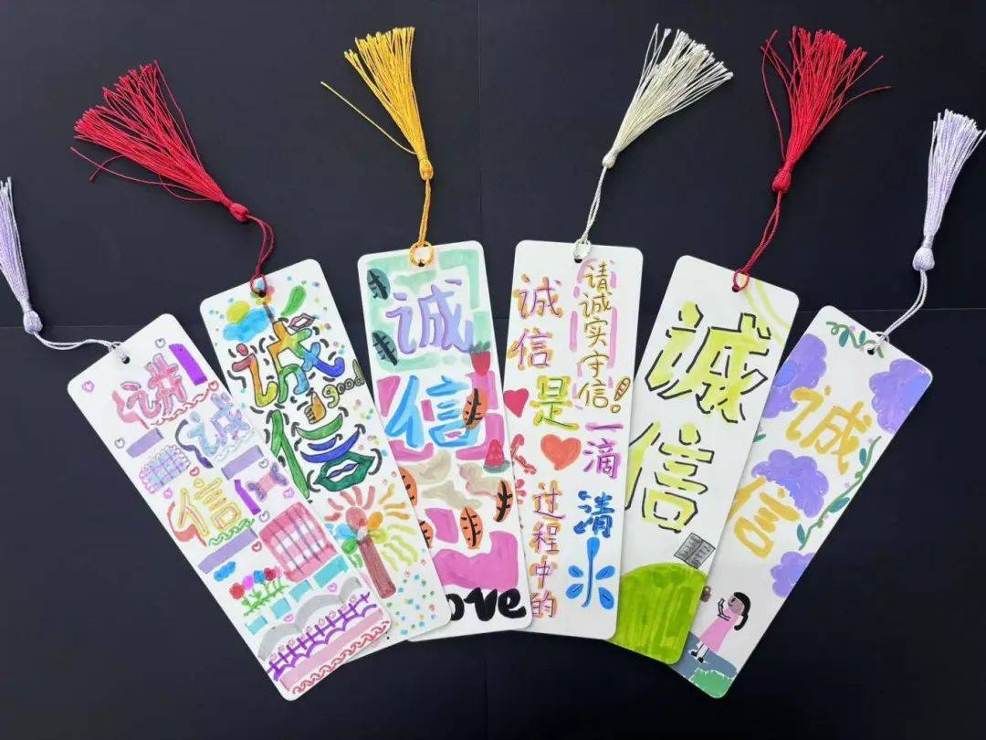 提升师生的道德品质和诚信素养,各校纷纷开展读书交流,书签制作,手